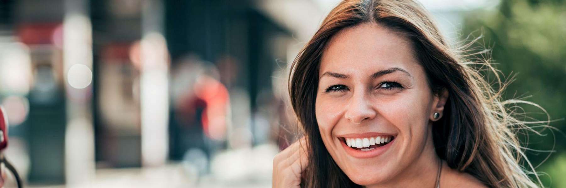 A woman smiling after getting Dental Bridges services in Pampa, TX?