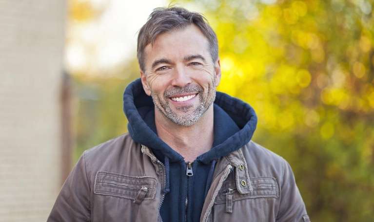 A man smiling after getting Dental implants in Pampa, TX