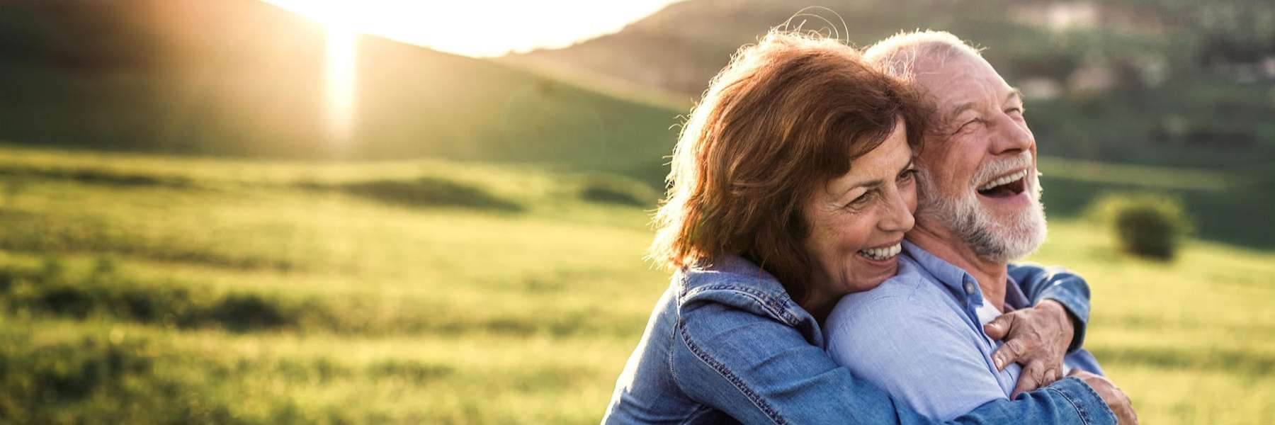 A couple smiling after getting Dental Crowns and Bridges treatment in Pampa, Tx